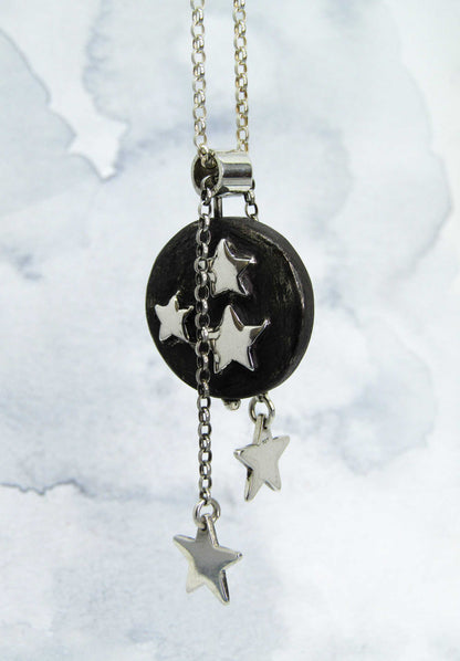 Illuminate pendant. Handmade solid silver pendant with highly polished star detail within a blackened disc.. Music jewellery. Music jewelry.  Irish design. Moveable art
