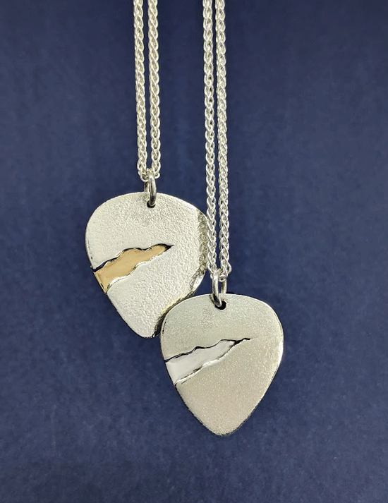 Handmade pendant inspired by Cohen's Anthem. Silver and gold detail. Musical jewellery