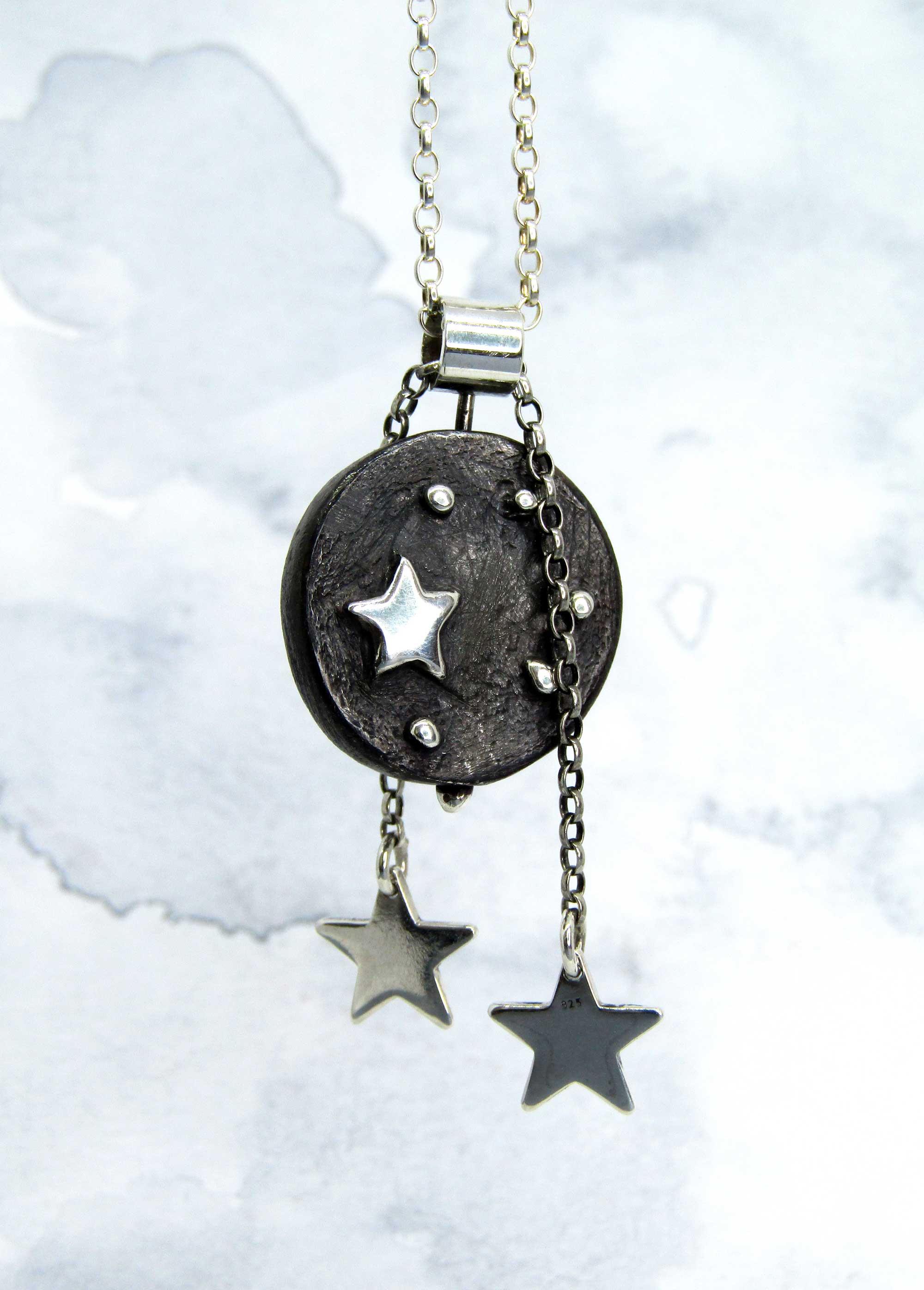 Illuminate pendant. Handmade solid silver pendant with highly polished star detail within a blackened disc.. Music jewellery. Music jewelry.  Irish design. Moveable art